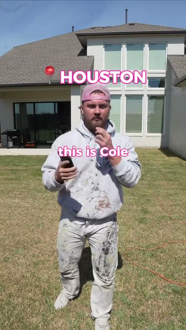 Crew member Cole on an exterior painting job in a Houston, TX backyard